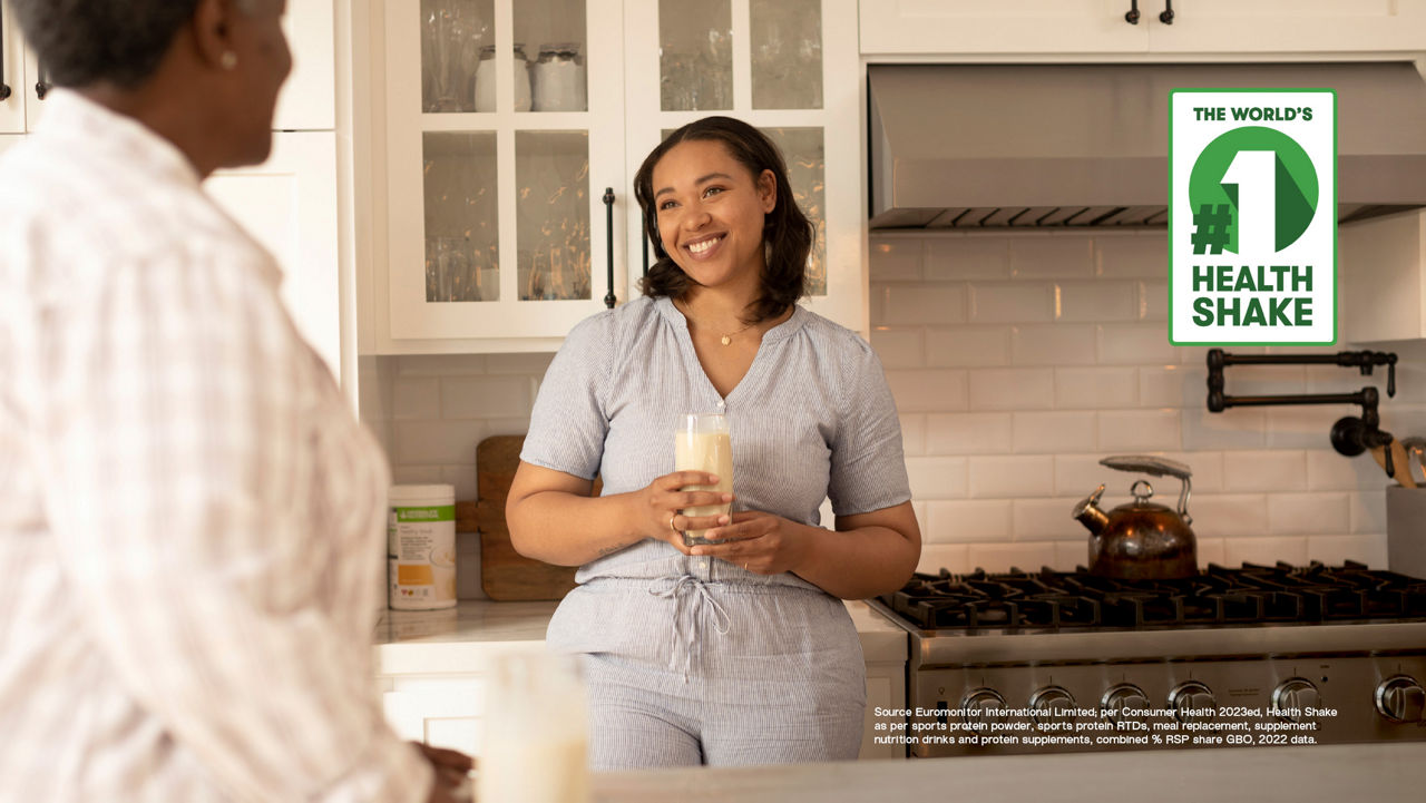 Woman pouring Formula 1 shake