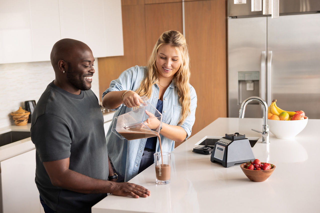 man woman healthy breakfast kitchen