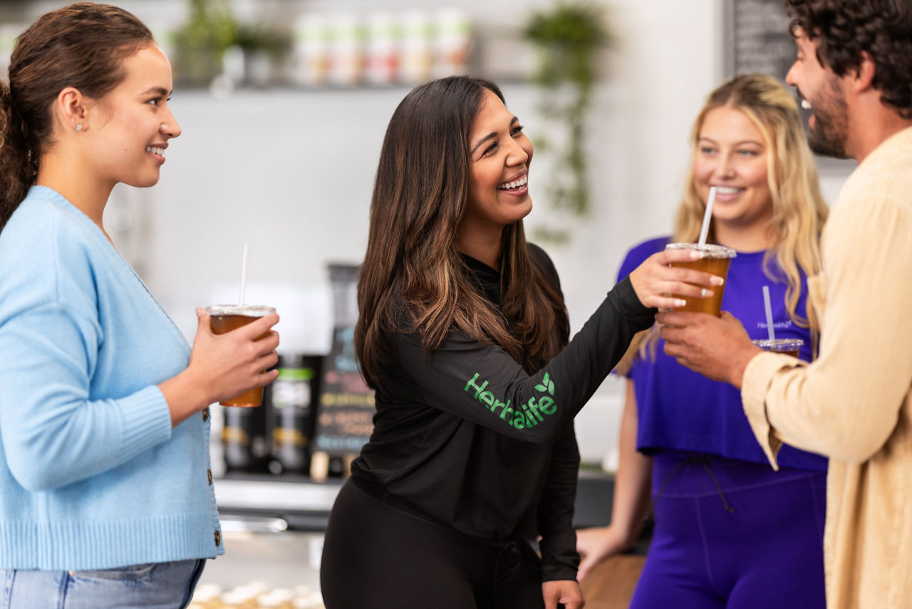 Group drinking tea and talking.