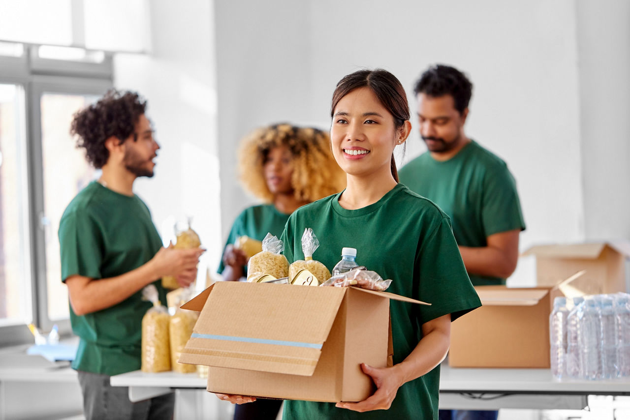 Volunteer Carrying a box