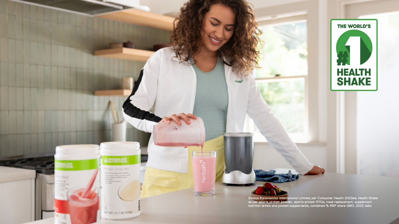 Woman pouring Formula 1 shake